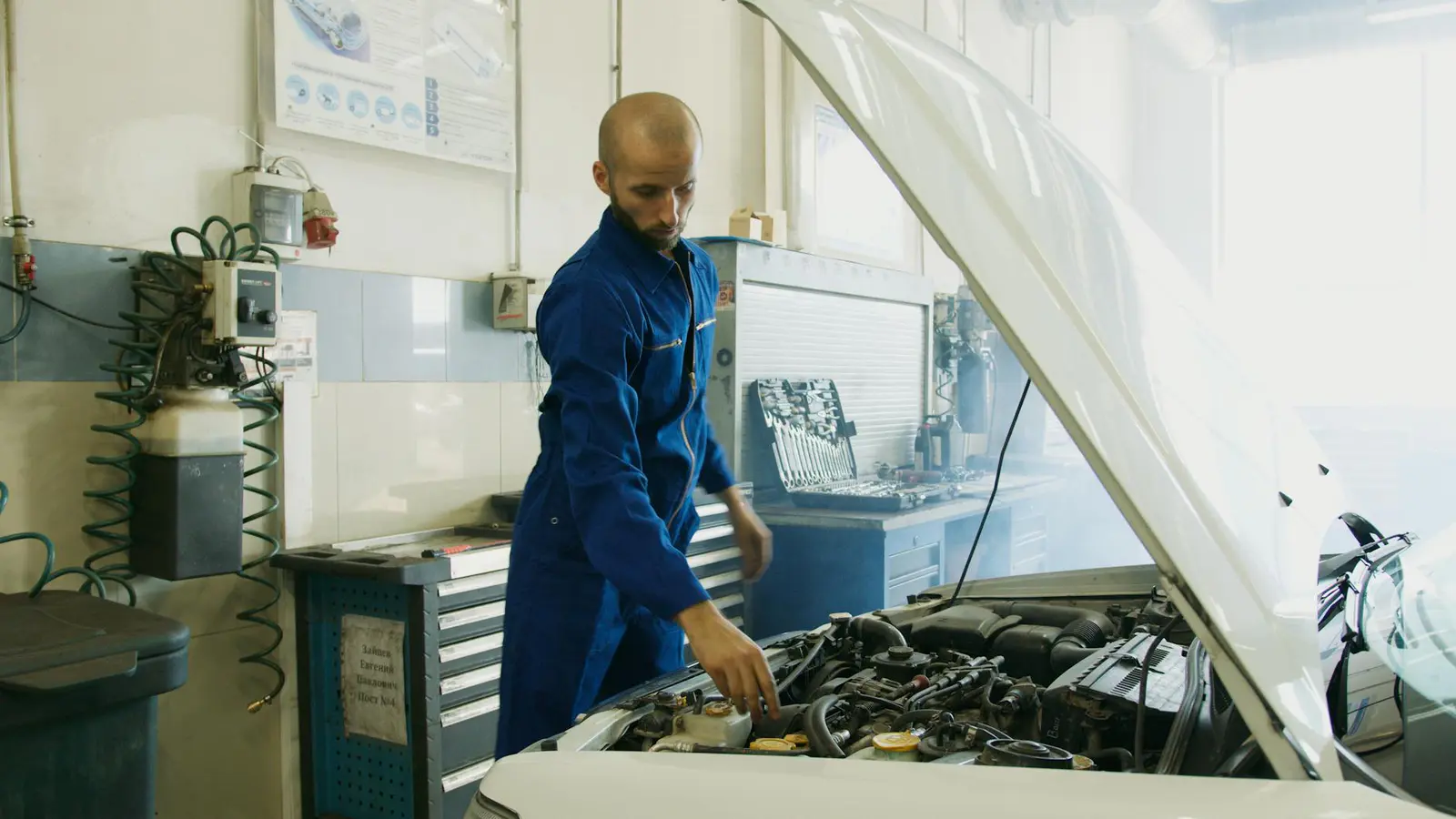 Mechanic inspecting a car